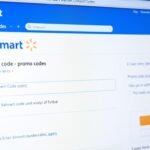 Person entering Walmart promo code at checkout screen showing Walmart Deals & Discount Codes